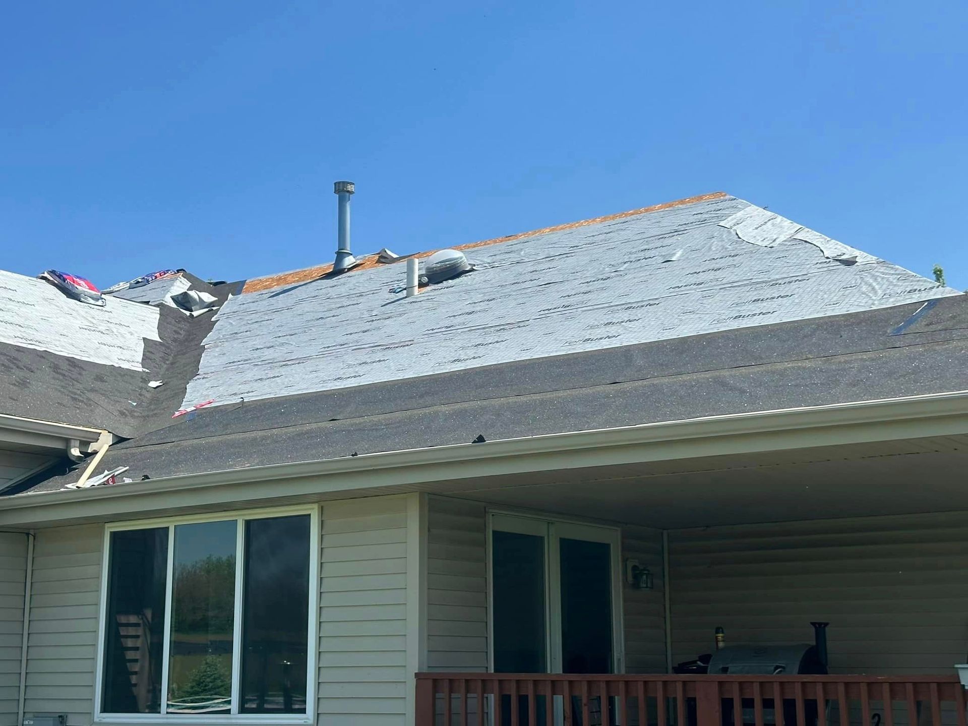 A house with a roof that is being repaired.