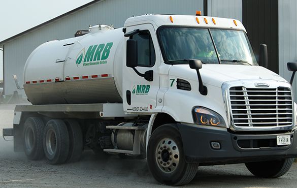 a MRB truck is parked in front of a building