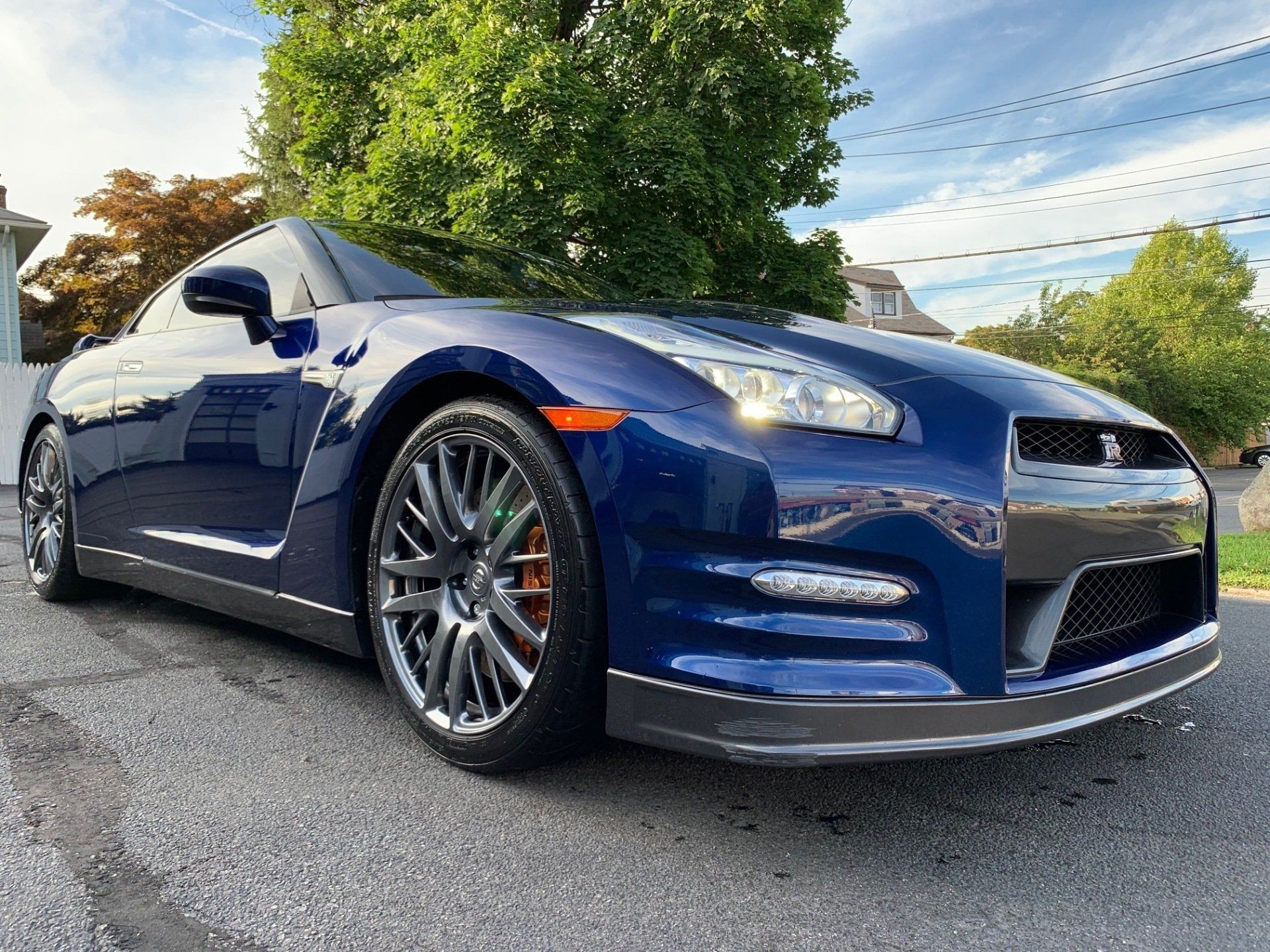 Close up of the front of a dark blue car