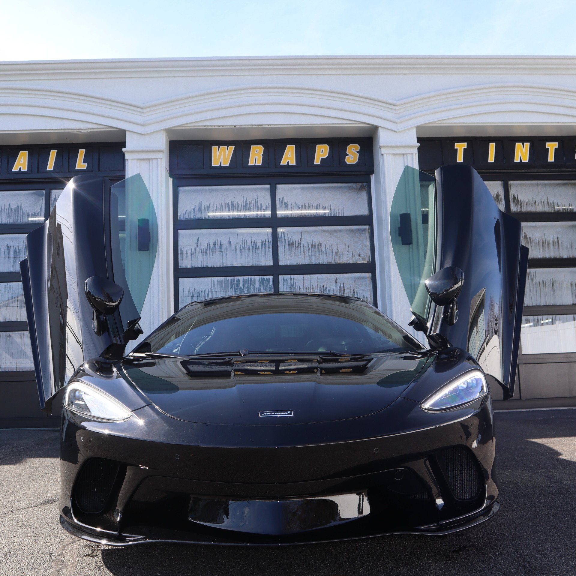 Black car with butterfly doors 