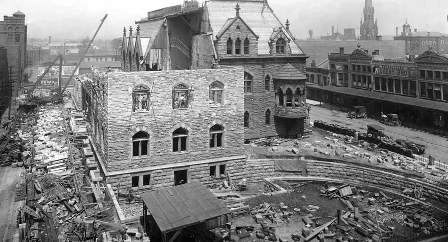 A black and white photo of a building under construction.