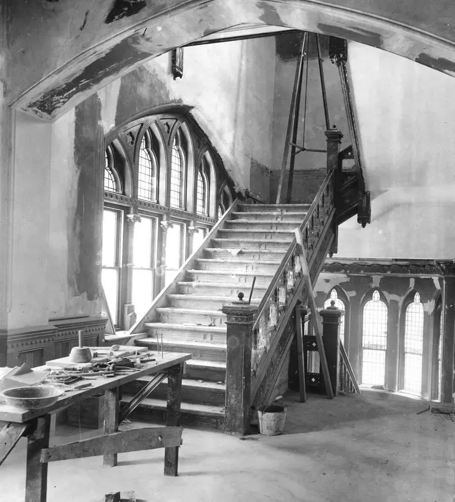 A black and white photo of a staircase in a building