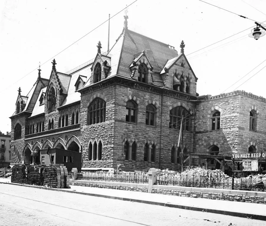 A black and white photo of a large stone building