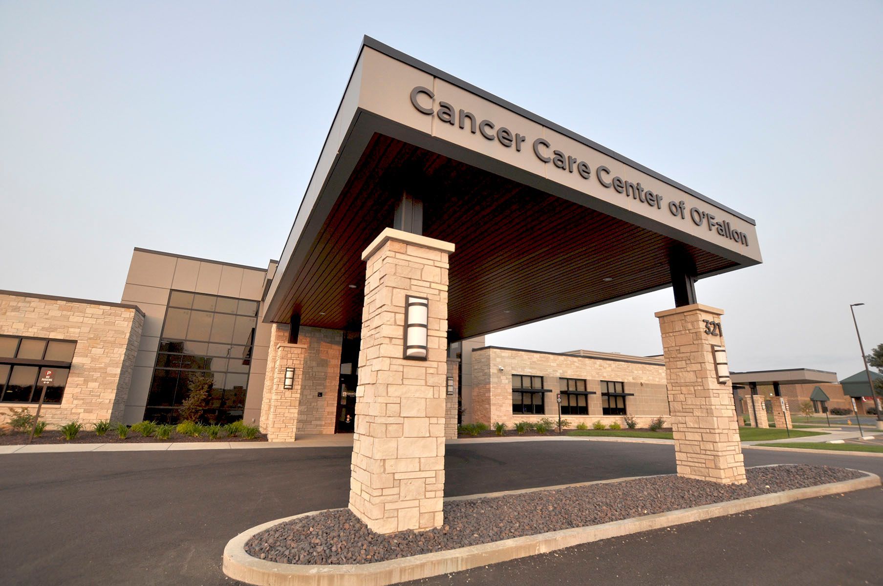 A large building with a sign that says cancer care center