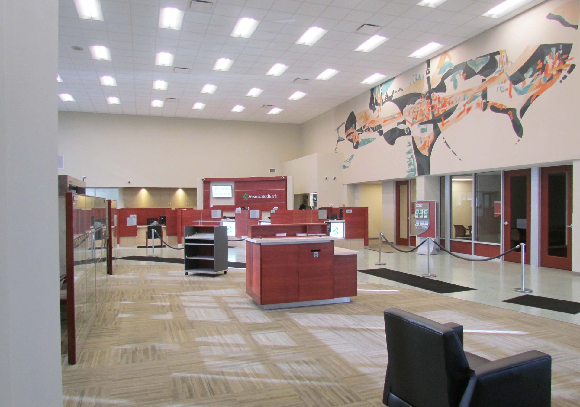 A large room with a painting on the wall