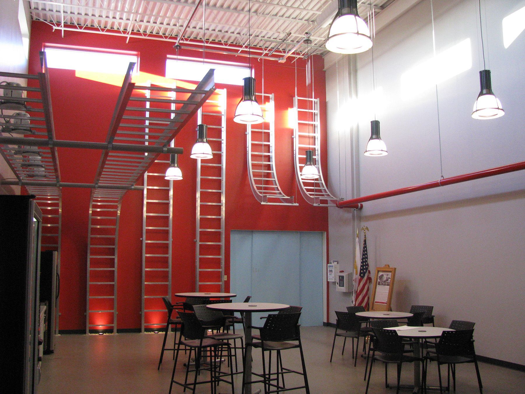 A large room with tables and chairs in it