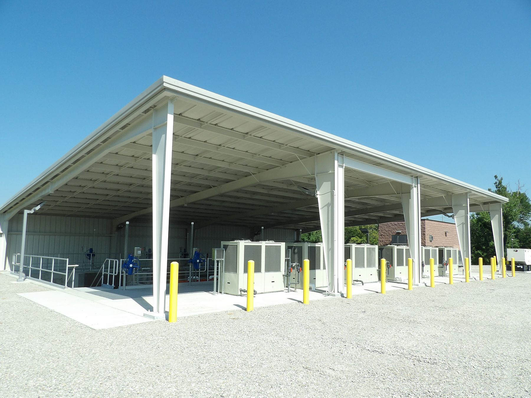 A large white building with a blue sky in the background