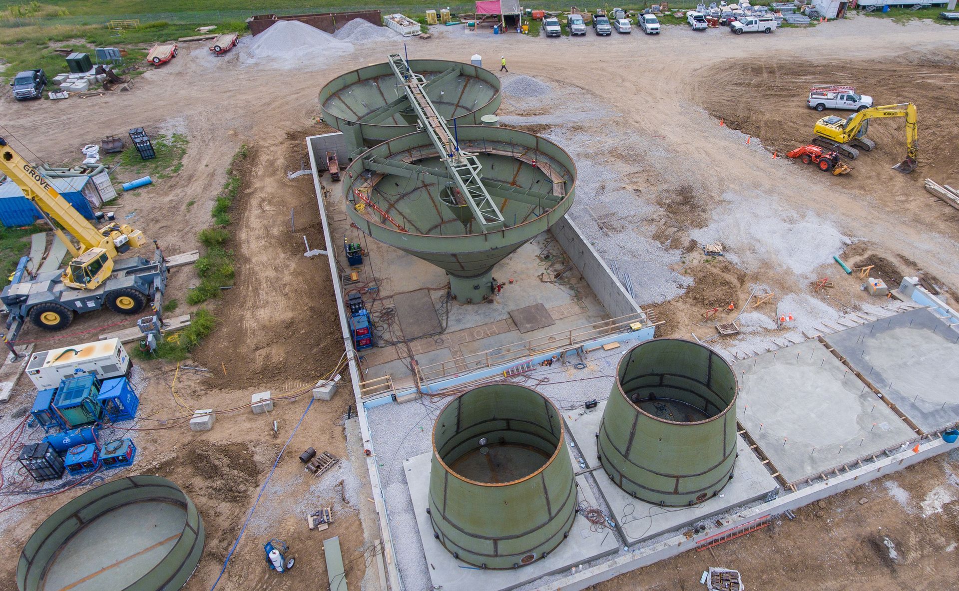 An aerial view of a construction site with a lot of machinery.