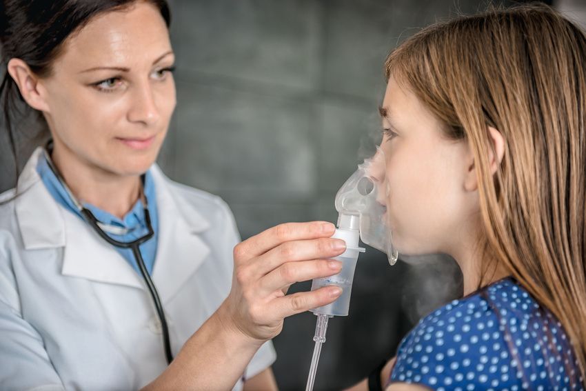 Doctor giving oxygen to patient