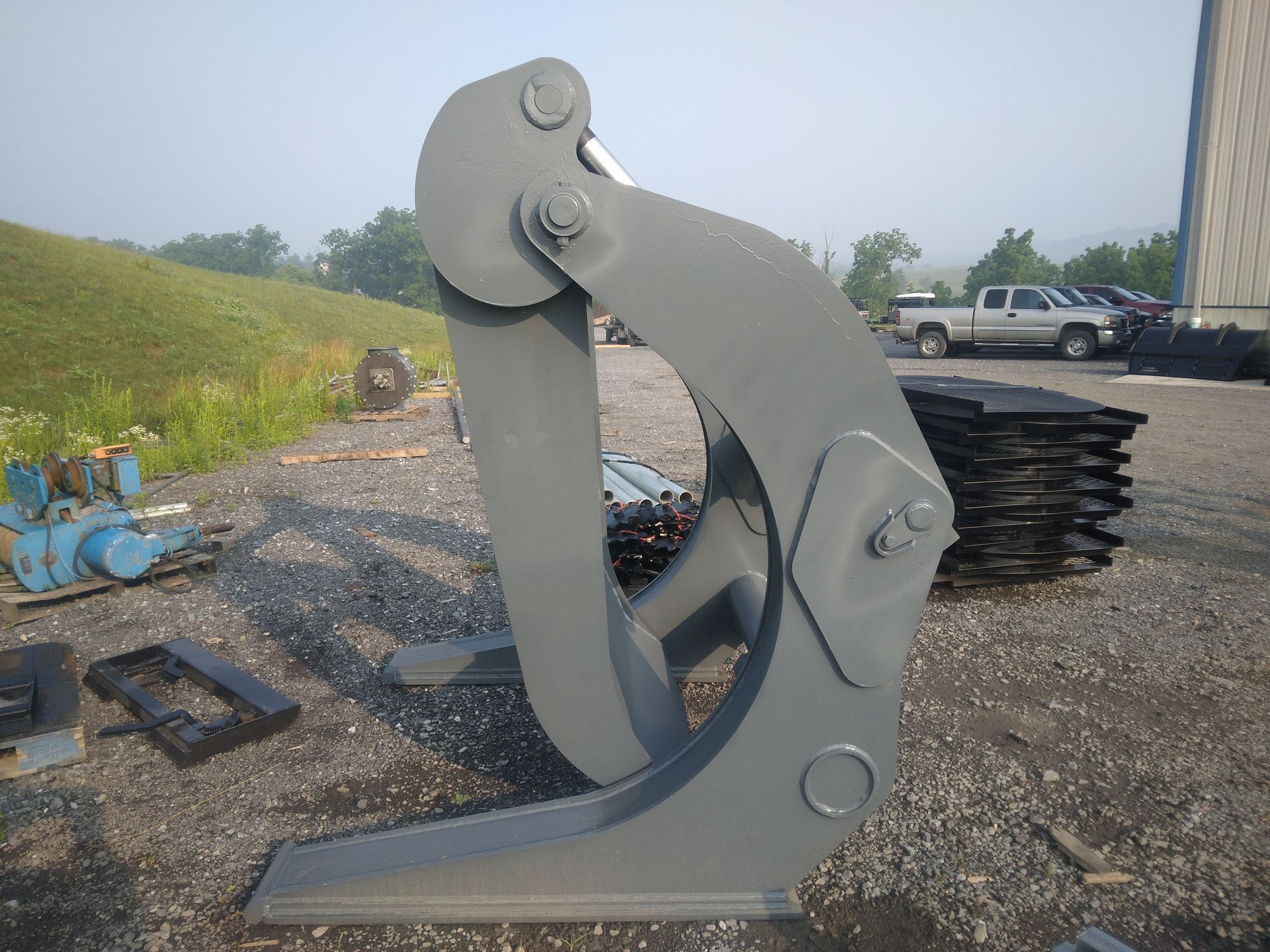 A large metal object is sitting in a gravel area