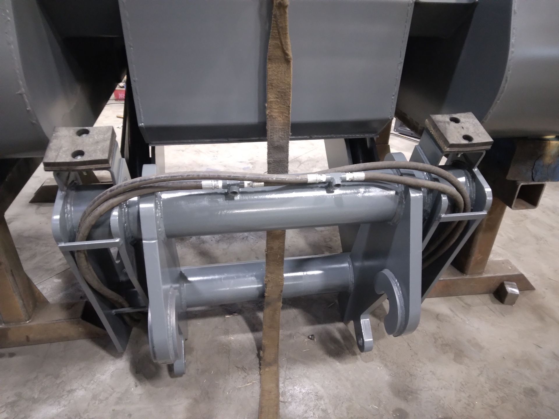 A piece of metal is sitting on a wooden table.