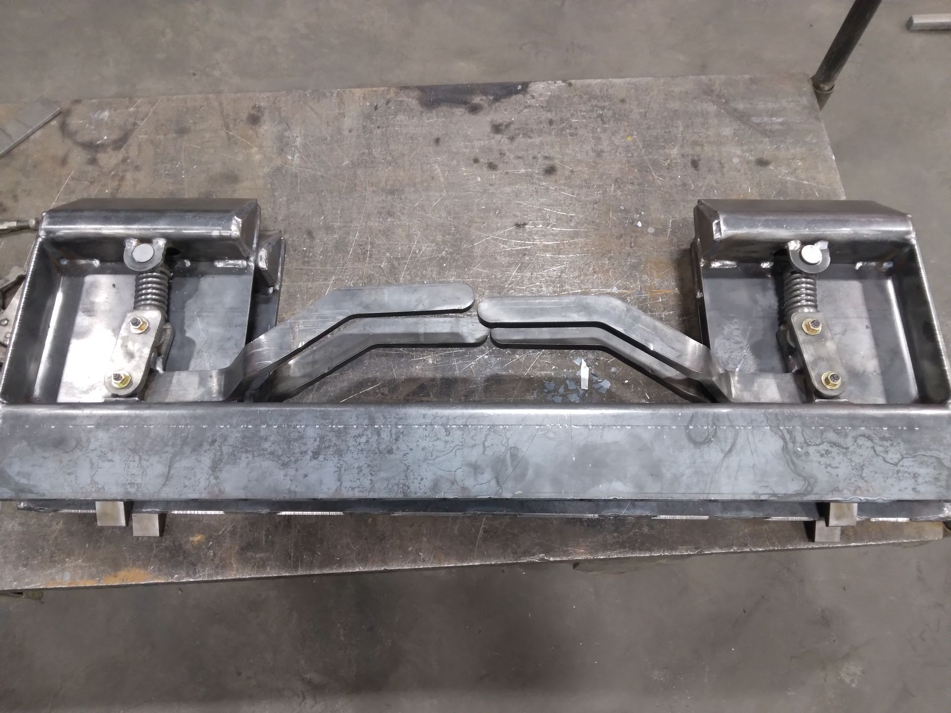 A piece of metal is sitting on top of a table