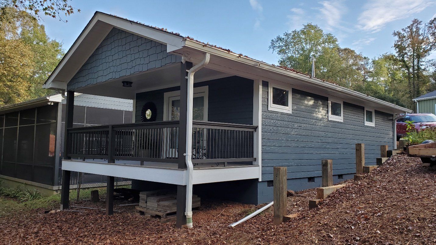 blue bungalow with deck