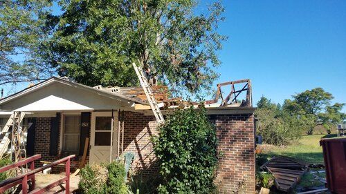 Tree damaged and remodeled home