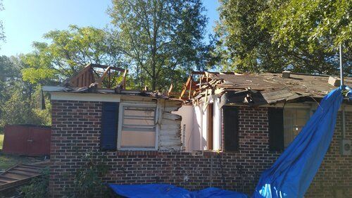 Tree damaged and remodeled home