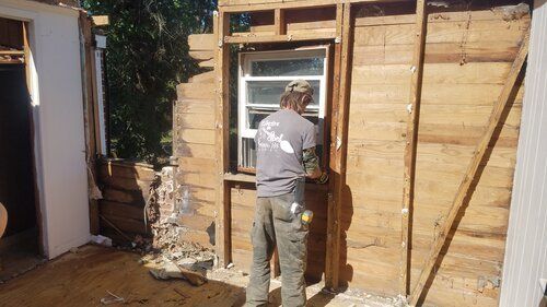 Tree damaged and remodeled home