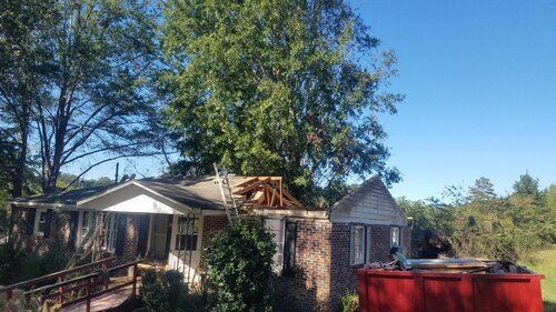 Tree damaged and remodeled home