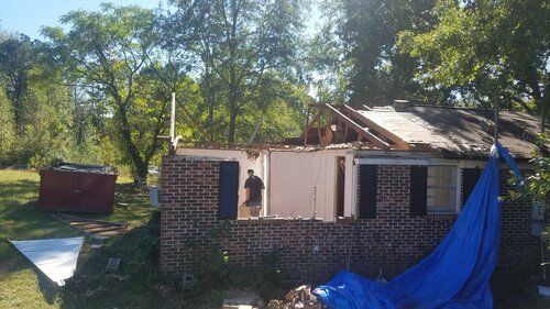 Tree damaged and remodeled home