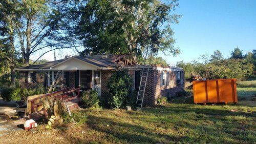 Tree damaged and remodeled home