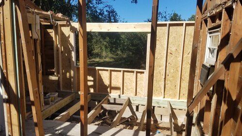 Tree damaged and remodeled home