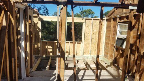 Tree damaged and remodeled home