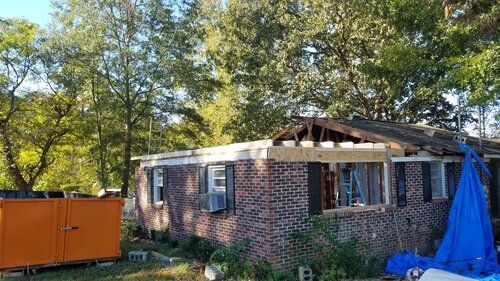 Tree damaged and remodeled home