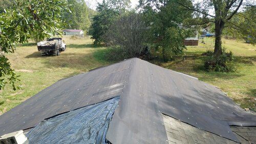 Tree damaged and remodeled home