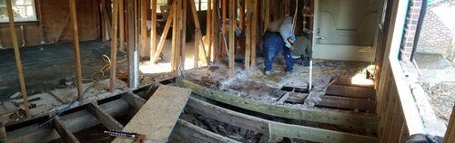 Tree damaged and remodeled home