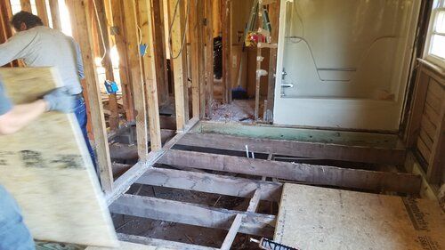 Tree damaged and remodeled home