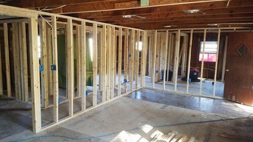 Tree damaged and remodeled home