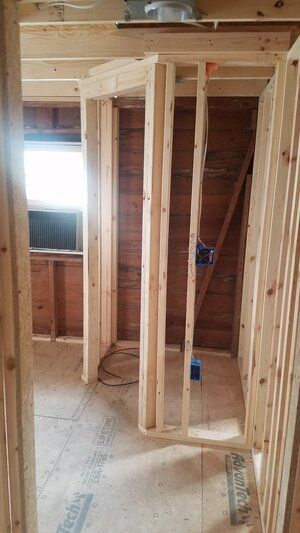 Tree damaged and remodeled home