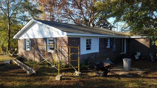 Tree damaged and remodeled home