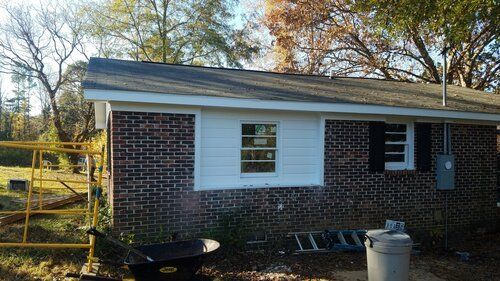 Tree damaged and remodeled home