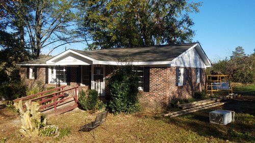 Tree damaged and remodeled home
