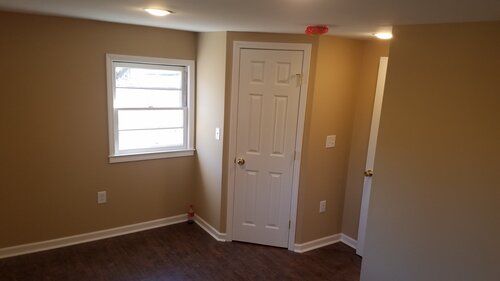 Tree damaged and remodeled home