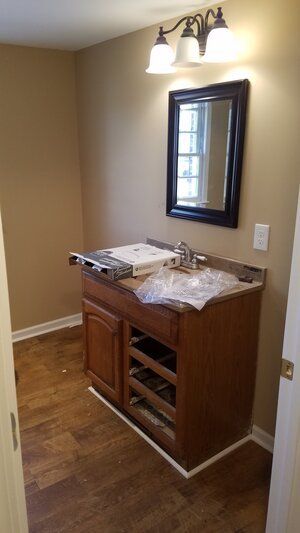 Tree damaged and remodeled home