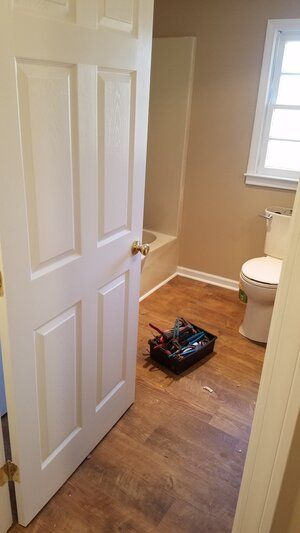 Tree damaged and remodeled home