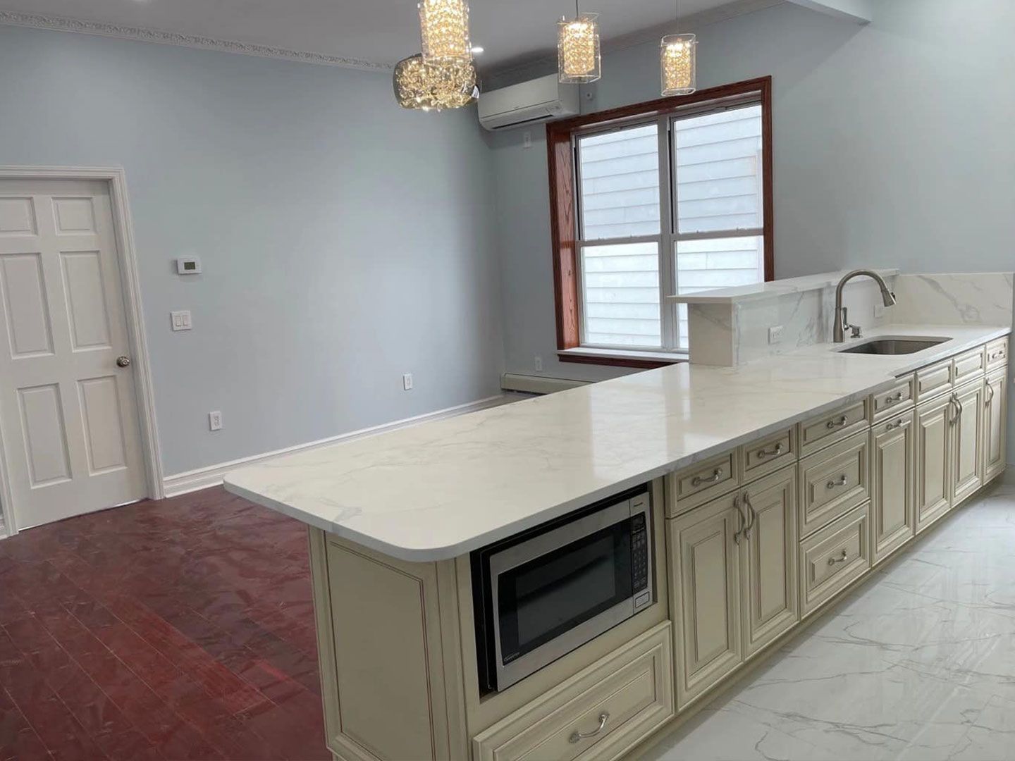 There is a large island in the middle of the kitchen.