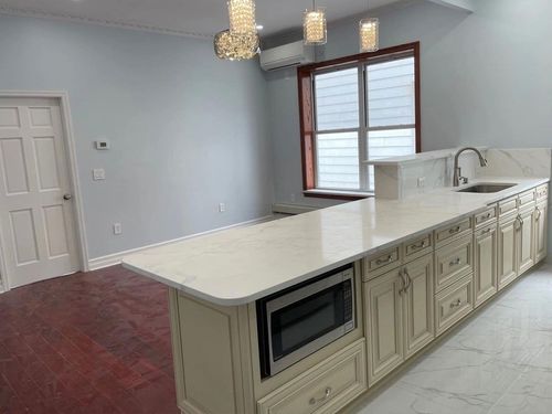 There is a large island in the middle of the kitchen.