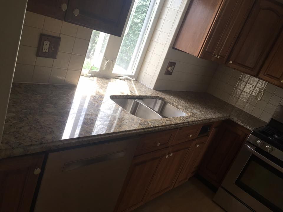 A kitchen with granite counter tops and a sink