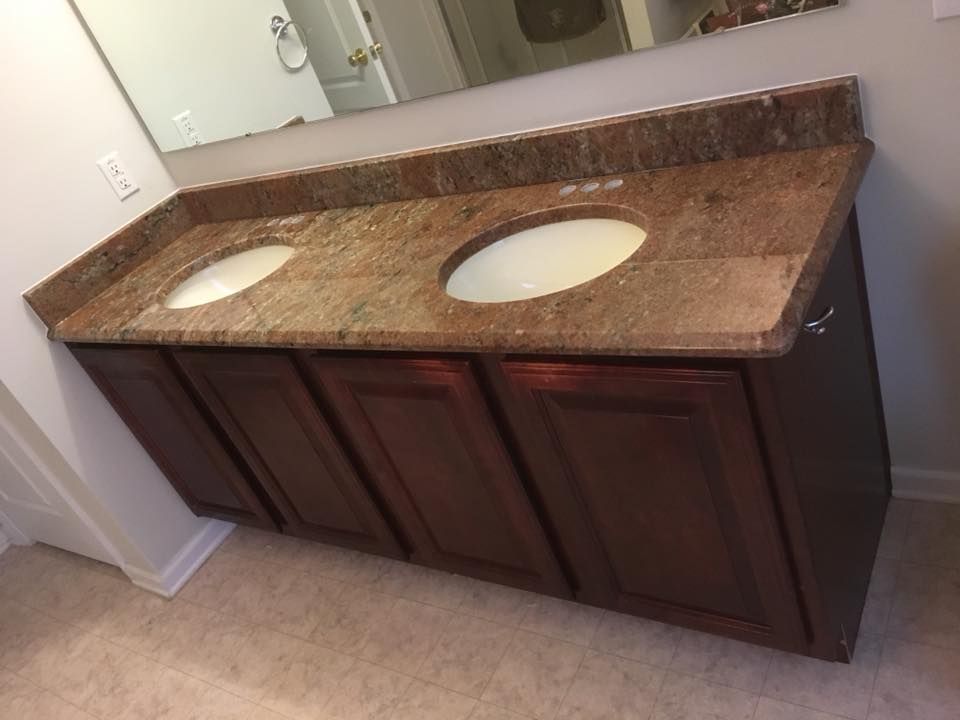A bathroom with two sinks and a large mirror