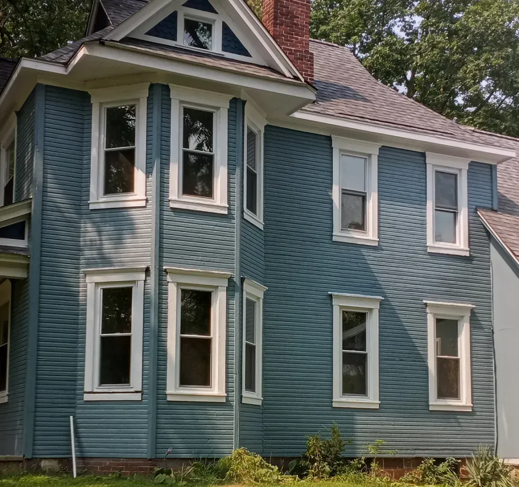 After photo of a blue house.