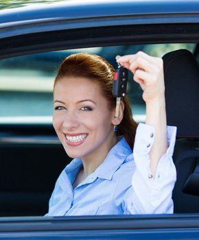 Woman holding a car key