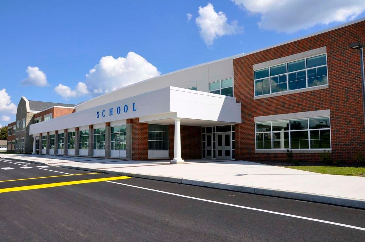 A large brick building with the word school on it