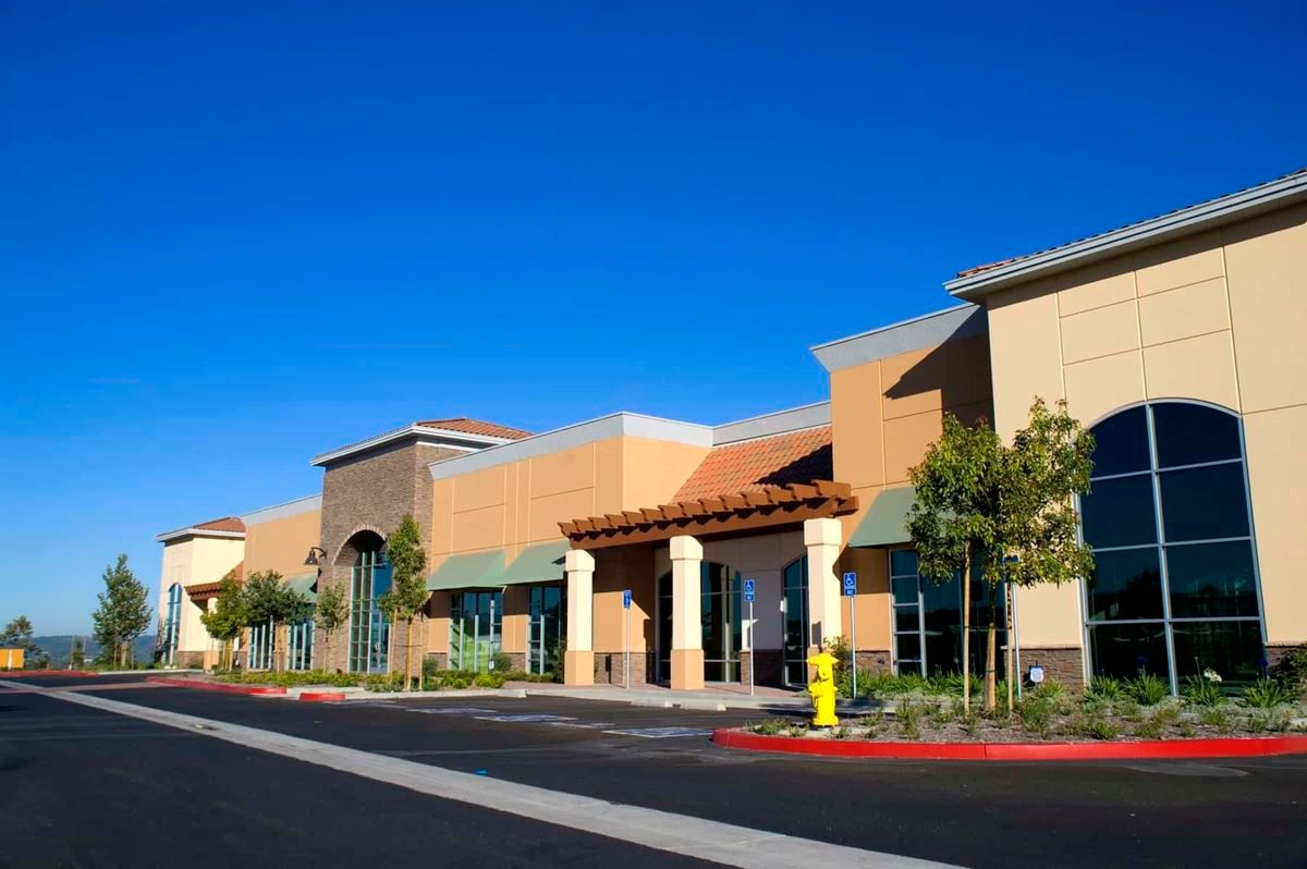 A large building with a fire hydrant in front of it.