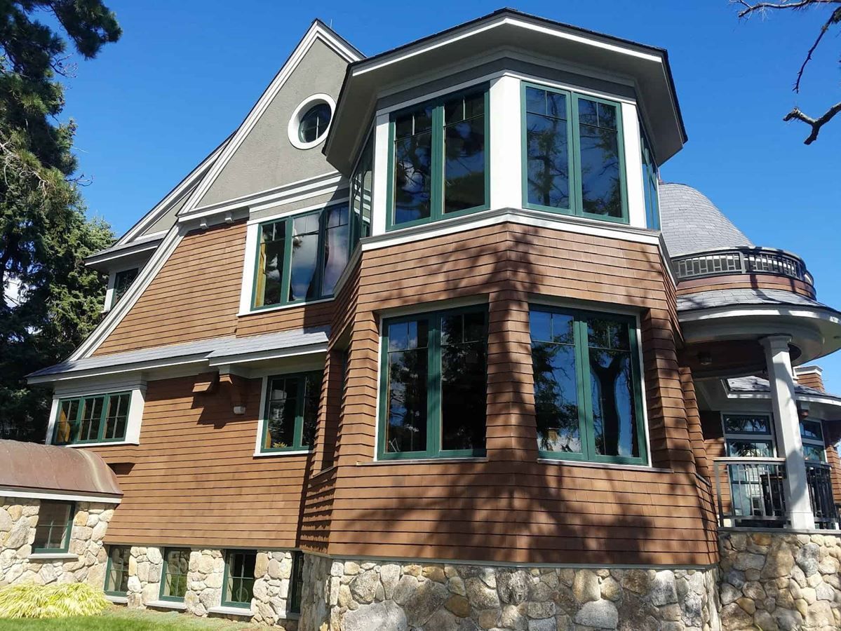 A large house with a lot of windows on a sunny day