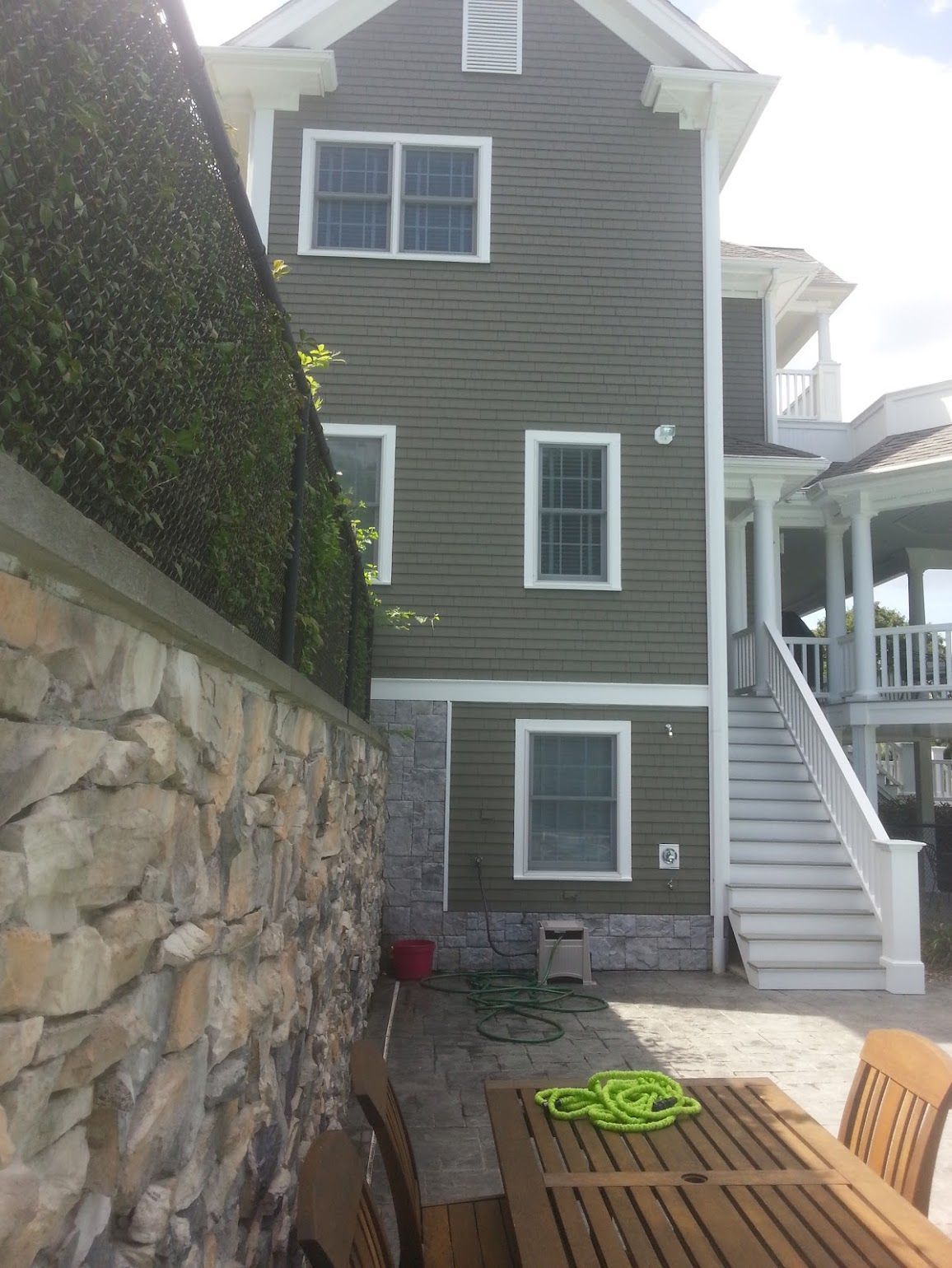 A house with a table and chairs in front of it