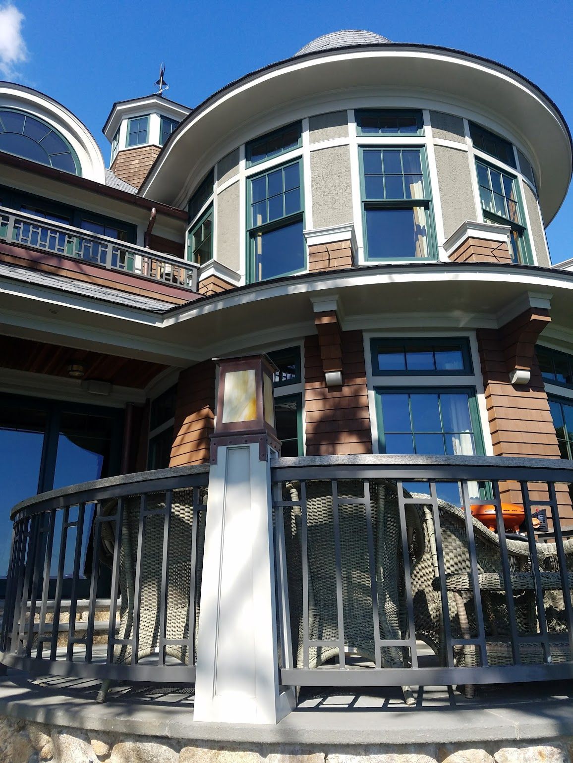 A large house with a balcony on the side of it