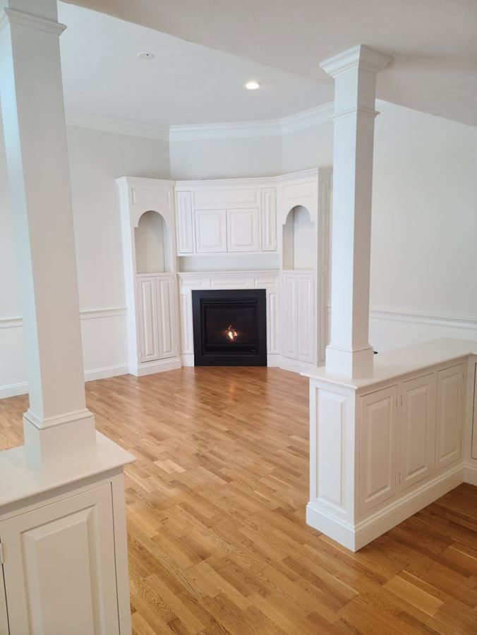 There is a fireplace in the middle of the room.