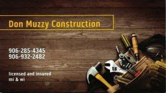 Business card for Don Muzzy Construction. Shows tools on wood background with phone numbers and 